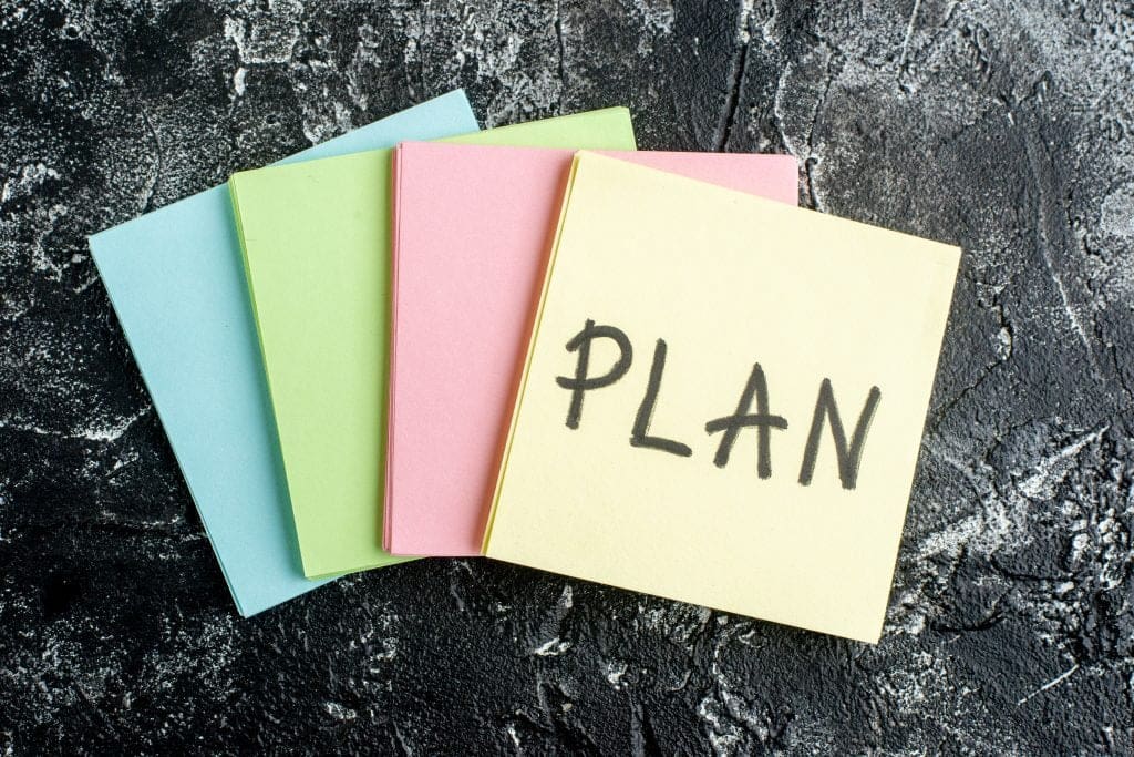 top view plan written note with colorful stickers dark gray background scaled